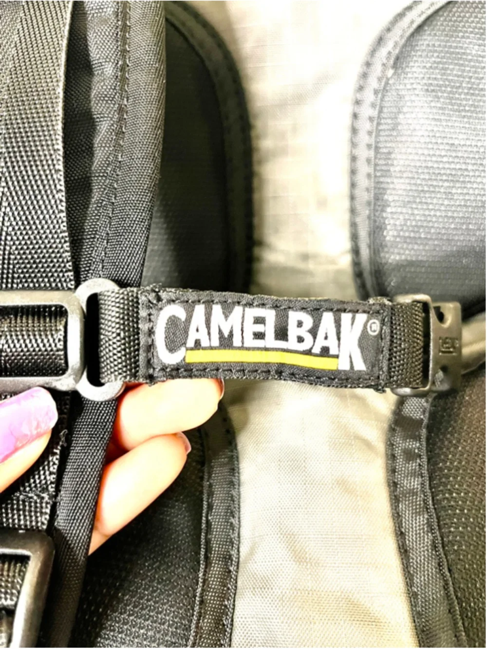 CamelBak M.U.L.E. hydration backpack features distinct yellow trim